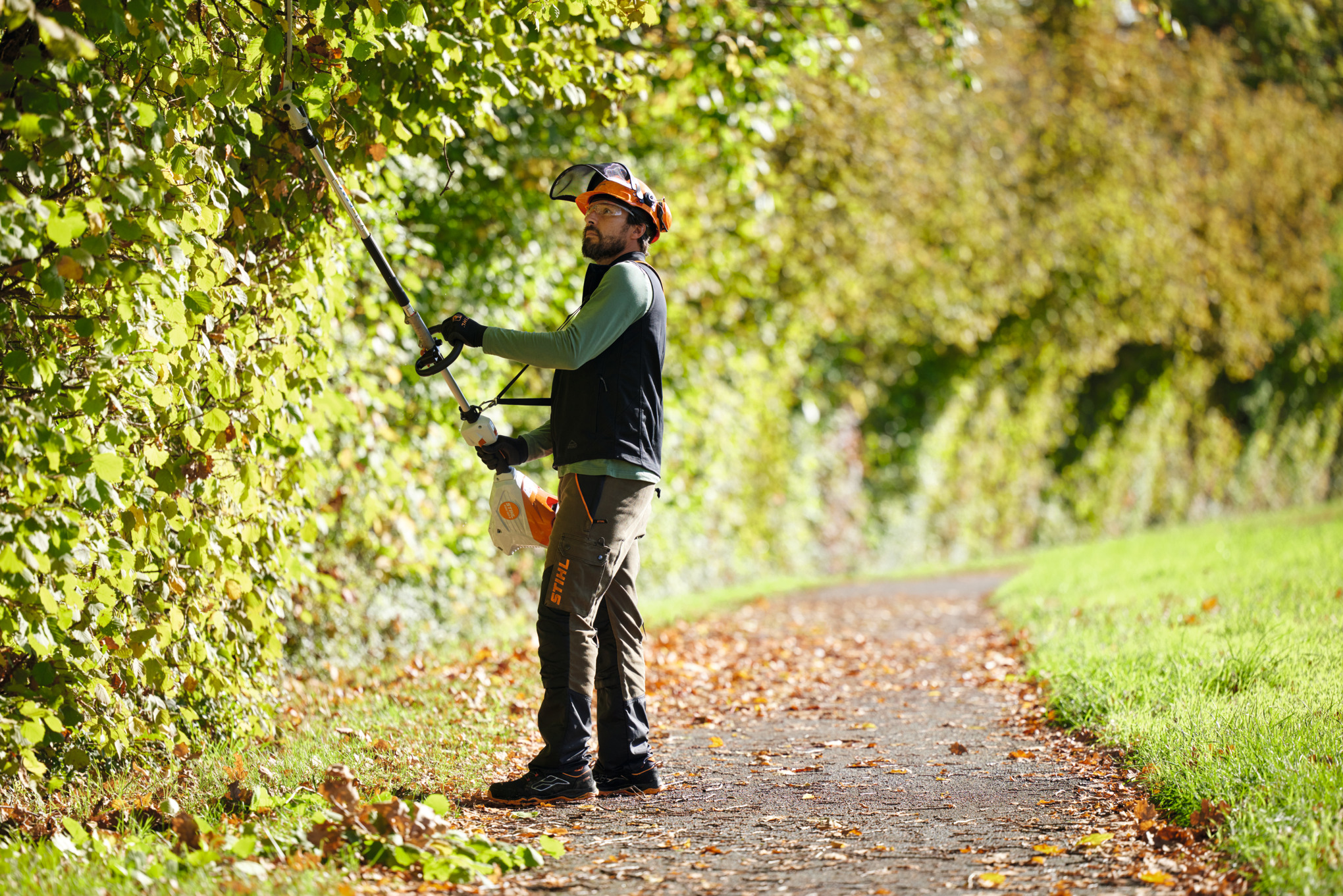 KMA 120 in use as a long reach hedge trimmer